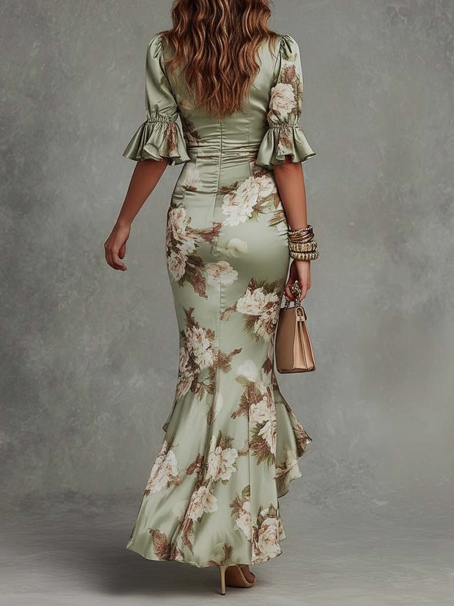 Anna | Asymmetrical long satin dress in green with V-neck, bell sleeves, and floral pattern